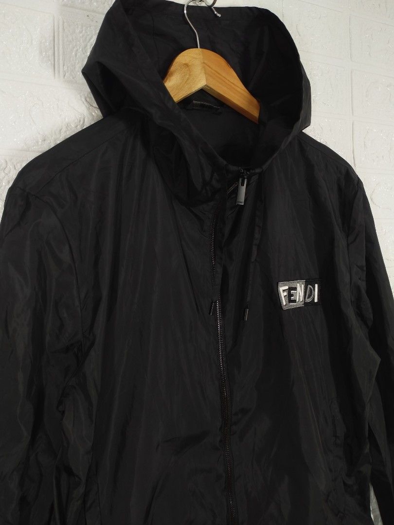 Fendi Black Hooded Jacket (Category: Luxury Apparel) located in Baguio. Submitted by dansteals (Listing ID 1427477552, Image 3). Description: Black Fendi hooded jacket. Features a front zipper closure and the Fendi logo on the chest. The jacket has a hood and a size tag indicating size 46. Made in Italy. The zipper pull also has the Fendi logo. 26 x 22 LARGE.