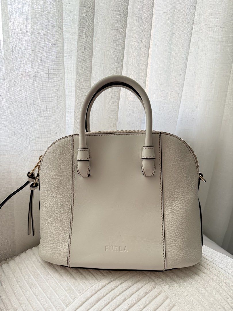 Furla Dome Handbag with Shoulder Strap (Category: Luxury Bags & Wallets) located in Quezon City. Submitted by closetpurgebyw (Listing ID 1427383071, Image 1). Description: Furla Miastella Dome Bag RFS: Decluttering a few bags I bought on impulse 👜 All are store-bought, and some have only been used 1-3 times. Still in excellent condition and well taken care of..