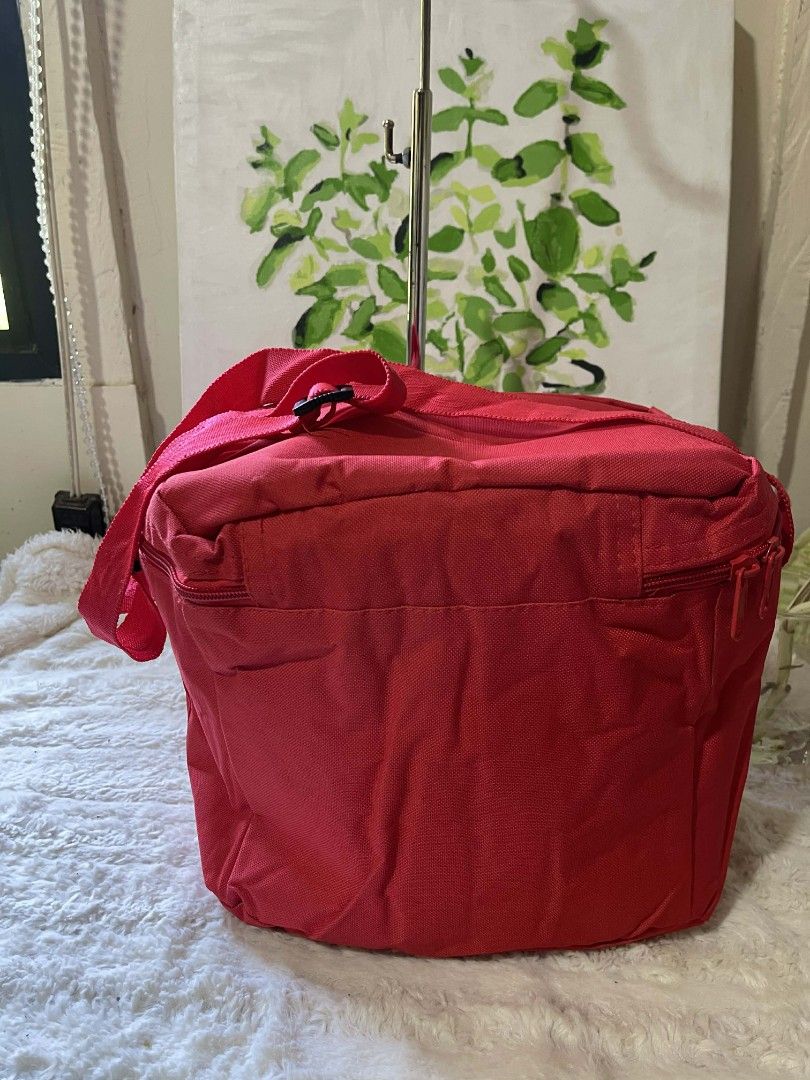 Henkel Red Cooler Bag (Category: Food Organization & Storage) located in Naawan. Submitted by twilly.apparel2 (Listing ID 1427358940, Image 3). Description: Red cooler bag features a Henkel logo on the front. It has a shoulder strap and a zippered closure. The interior is insulated with a silver lining..