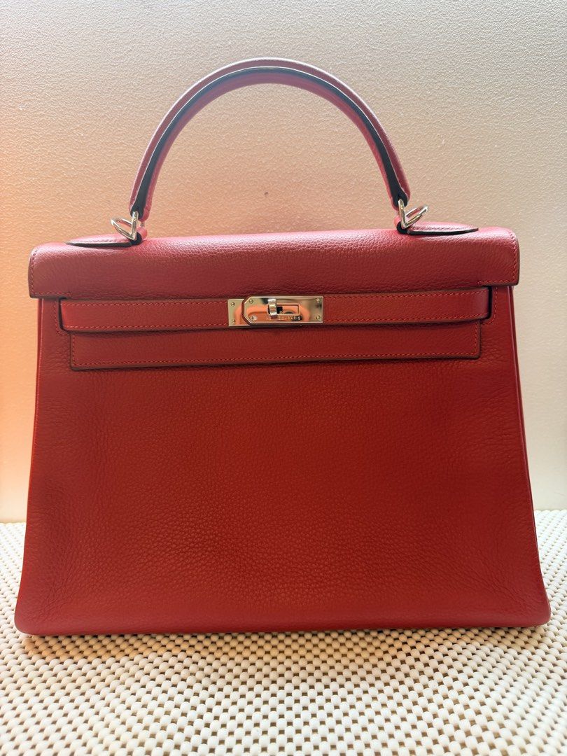 Hermes Kelly Bag Red (Category: Luxury Bags & Wallets) located in Manila. Submitted by jamilla01 (Listing ID 1427350726, Image 1). Description: Authentic With clochette, lock and Keys. No box With dustbag.