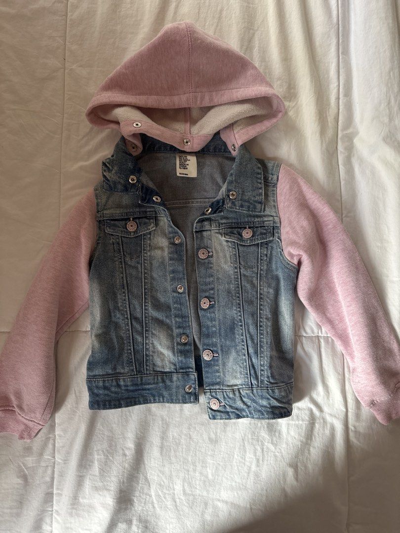 H&M Denim Jacket with Hood US6-7 (Category: Babies & Kids Fashion) located in Muntinlupa City. Submitted by shopnb (Listing ID 1427381991, Image 1). Description: Denim jacket from H&M features a pink hood and sleeves. It has a button-up front and two chest pockets. The jacket is a light blue wash. The jacket has a pink hood and sleeves..