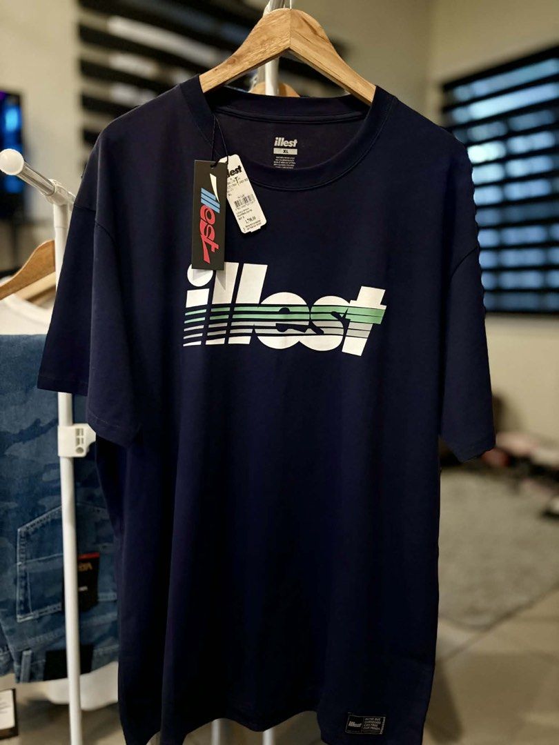 Illest Navy Blue Graphic Tee XL (Category: Tshirts & Polo Shirts ) located in Pasig City. Submitted by sneakeasy (Listing ID 1427324070, Image 1). Description: For Sale Bnew Legit Srp Bnew illest shirt Dark Navy blue color Sizes Large Dimes(22.5 x 30.5)fit to Large to XL frame XL Dimes(23.5 x 32)fit to XL to XXL frame Location Pasig.