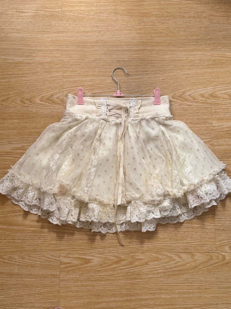 Liz Lisa Lace Skirt (Category: Skirts) located in Manila. Submitted by tungtungsahurting (Listing ID 1427436901, Image 1). Description: - Liz Lisa Tule Skirt in Cream - freesize - flaws: as seen in pictures (stains *may* be removable) .