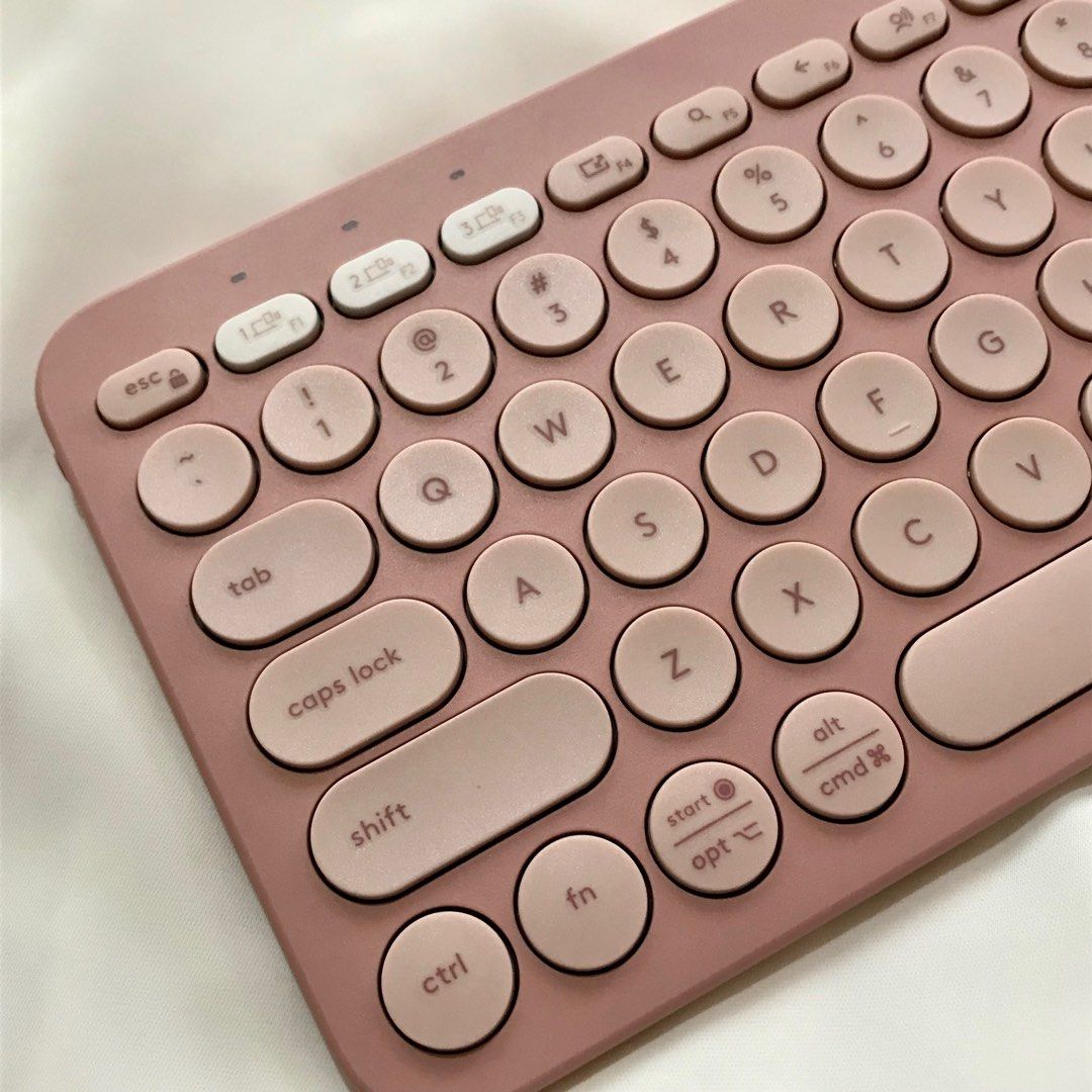 Logitech Pebble Keys 2 K380s Wireless Keyboard (Category: Computer Keyboard) located in Bauang. Submitted by tavias.shop (Listing ID 1427367818, Image 3). Description: Logitech Pebble Keys 2 K380s wireless keyboard in a dusty rose color. It is a multi-device, portable keyboard. The keyboard has round keys and a compact design. The box is included. The back of the keyboard has the model information. It is a Bluetooth keyboard..