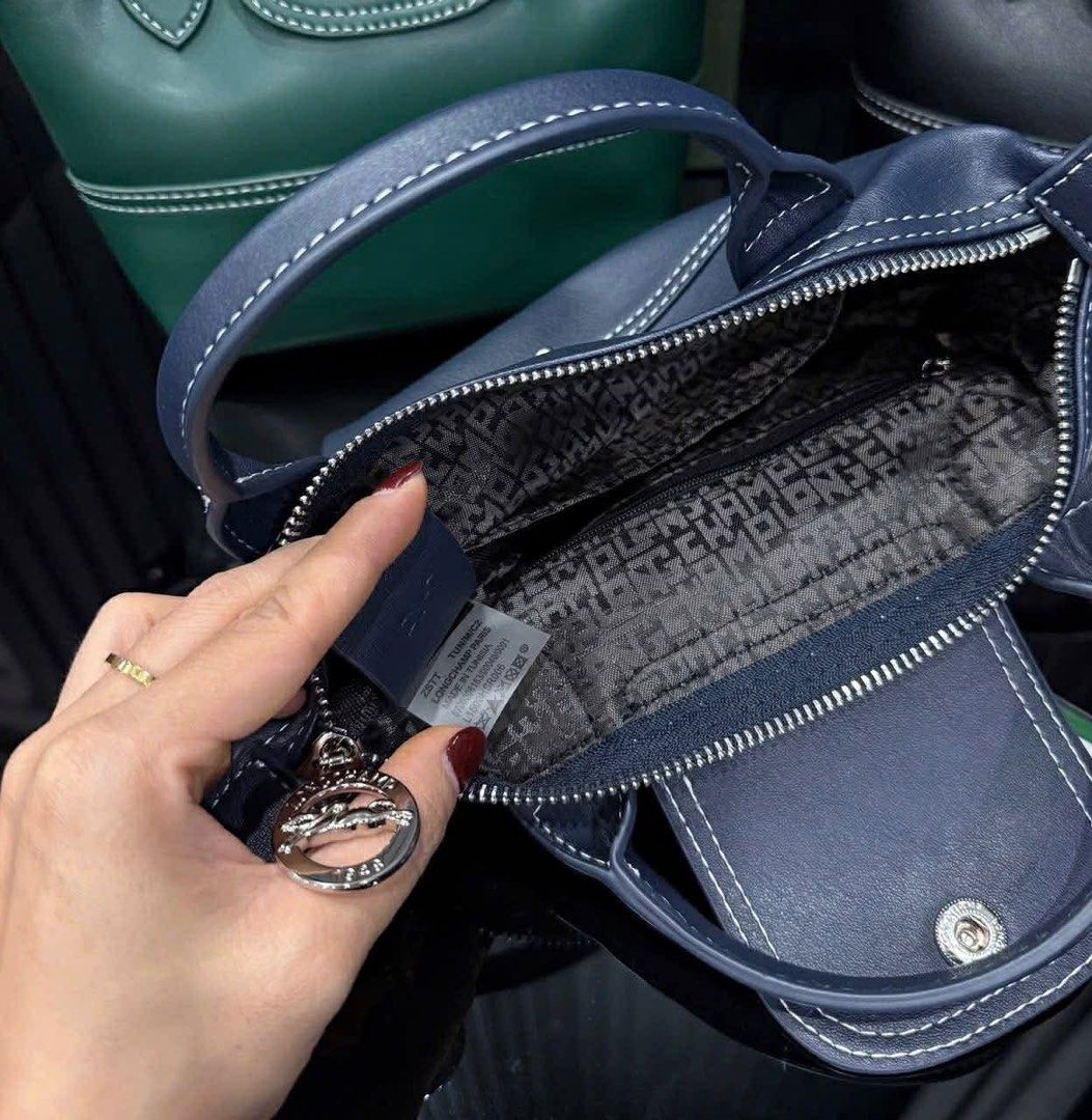 Longchamp Le Pliage Xtra XS Handbag with strap Cowhide leather (Category: Luxury Bags & Wallets) located in Pasig City. Submitted by lace_89 (Listing ID 1427358421, Image 3). Description: Brand new Longchamp Le Pliage Xtra XS Handbag with strap Cowhide leather in black and navy blue With box and cloth bag ₱10,499.
