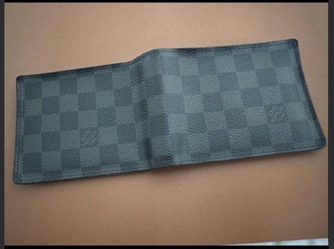 Louis Vuitton Damier Graphite Wallet (Category: Luxury Bags & Wallets) located in Makati City. Submitted by garaheniklur (Listing ID 1427426903, Image 3). Description: For Sale- LV Bi-Fold Graphite Used but not abused No scuffs on the side Provisions for 8 cards, picture or ID, coin purse and paper bills With box and dustbag RFS: prefers card wallet.