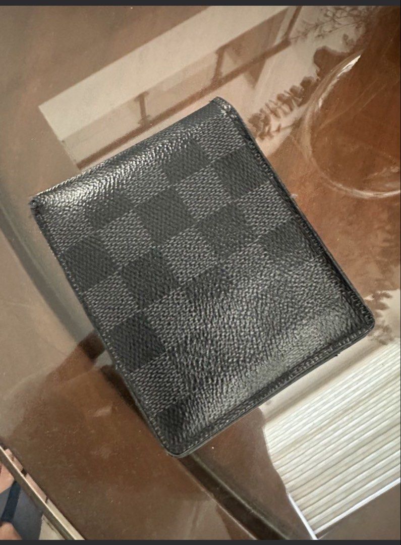 Louis Vuitton Damier Graphite Wallet (Category: Luxury Bags & Wallets) located in Makati City. Submitted by garaheniklur (Listing ID 1427426903, Image 2). Description: For Sale- LV Bi-Fold Graphite Used but not abused No scuffs on the side Provisions for 8 cards, picture or ID, coin purse and paper bills With box and dustbag RFS: prefers card wallet.