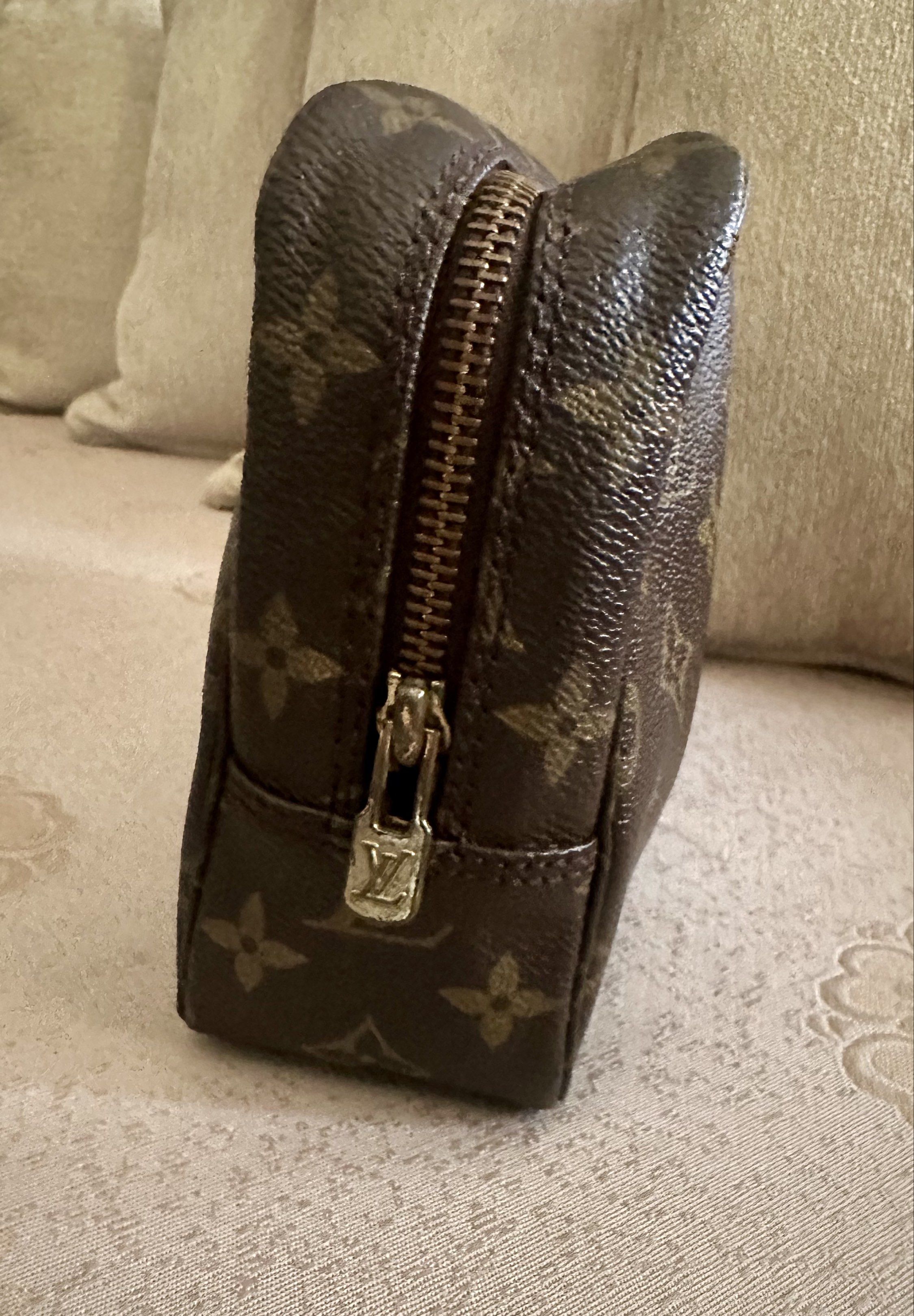 Louis Vuitton Toiletry Pouch (Category: Luxury Bags & Wallets) located in Quezon City. Submitted by armieesq (Listing ID 1427365160, Image 2). Description: Louis Vuitton Pre-Owned Monogram Trousse Toilette clutch bag Made in France monogram canvas body • top zip closure • interior slip pocket • brown • Serial Number: 874 TH • This item has no inclusions except for provided dust bag. • Condition: EXCELLENT w/ minimal zipper tarnish. Measurements: 