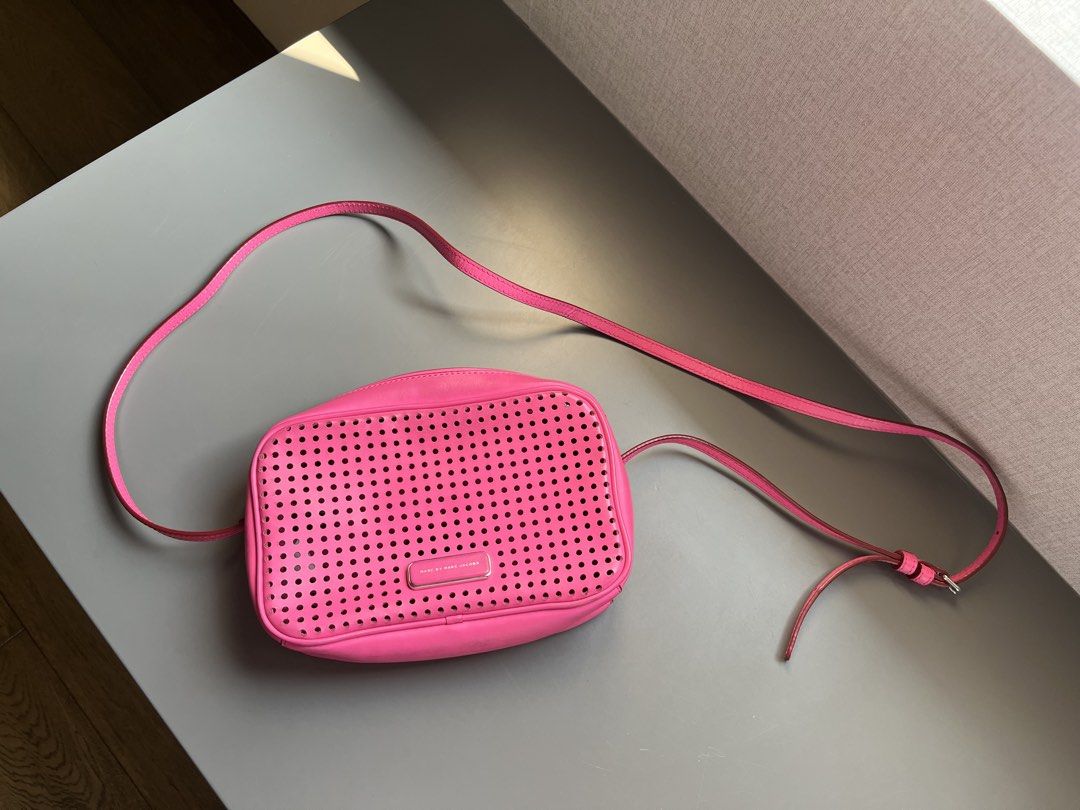 Marc by Marc Jacobs Perforated Crossbody Bag (Category: Luxury Bags & Wallets) located in Quezon City. Submitted by deesea (Listing ID 1427365023, Image 1). Description: Marc Jacobs Pink Crossbody Bag Leather Lightly used, well taken cared off .
