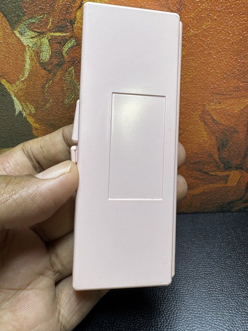 Max Factor Empty Makeup Palette Case - Pink 4-Pan Compact with Mirror (Category: Makeup) located in Mangaldan. Submitted by thriflip_online_shop (Listing ID 1427375396, Image 2). Description: This is a charming Max Factor makeup compact/palette case in a soft pastel pink. It features a sleek, rectangular design with the classic Max Factor branding on the front corner. • Internal Layout: The interior contains four circular wells, perfect for holdi