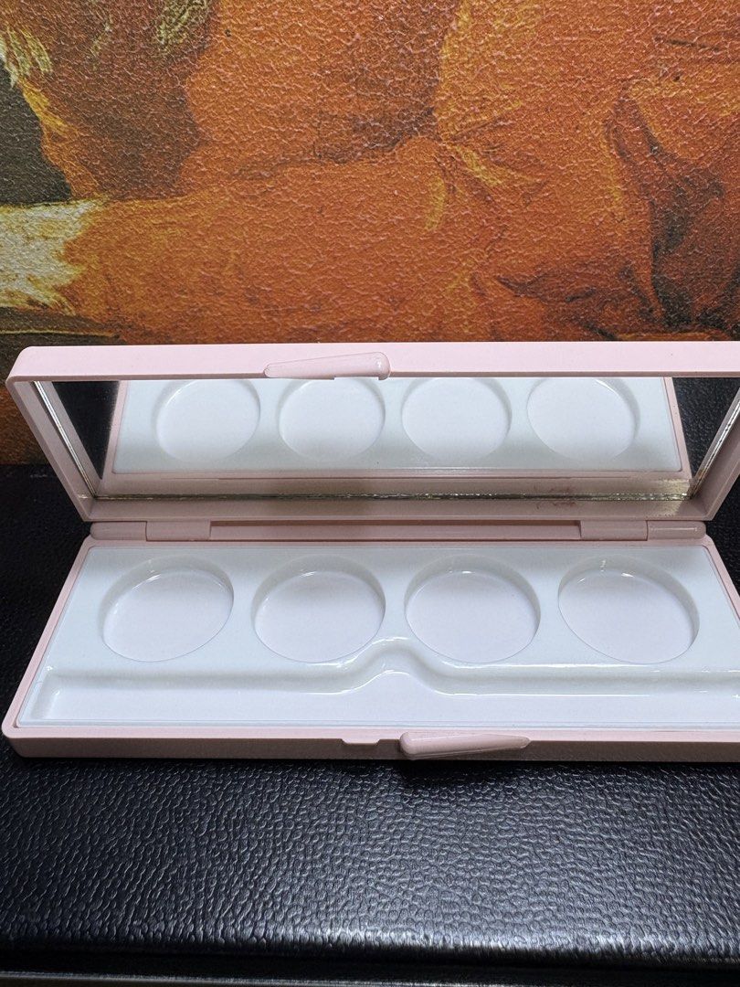 Max Factor Empty Makeup Palette Case - Pink 4-Pan Compact with Mirror (Category: Makeup) located in Mangaldan. Submitted by thriflip_online_shop (Listing ID 1427375396, Image 3). Description: This is a charming Max Factor makeup compact/palette case in a soft pastel pink. It features a sleek, rectangular design with the classic Max Factor branding on the front corner. • Internal Layout: The interior contains four circular wells, perfect for holdi