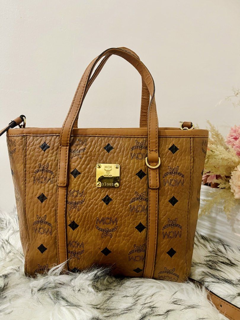 Mcm Toni Top Shopper Visetos Cognac (Category: Luxury Bags & Wallets) located in Teresa. Submitted by savvyonbranded (Listing ID 1427479385, Image 1). Description: 8 x 10 x 3 inches Minimal sign of use on handle Turnable screw, ykk zipper.