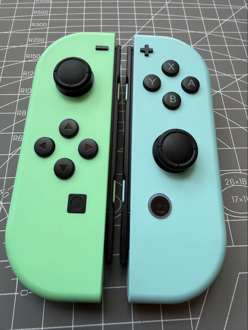 Nintendo Switch Joycon Animal Crossing (Category: Controllers) located in Makati City. Submitted by see5o5 (Listing ID 1427338690, Image 2). Description: Original Animal Crossing edition joycons. Mint condition, only used a couple of times and put away to preserve the condition. Includes the matching straps. Also included are TPU covers to protect the joycons. .