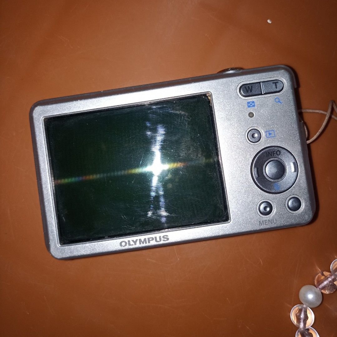 Olympus Digital Camera (Category: Cameras) located in Tabaco. Submitted by byersss (Listing ID 1427397013, Image 2). Description: OLYMPUS VG-150 fully functional; flash and all buttons are working body condition: 8/10 issue: vertical line at the middle; output not affected inclusions: - battery (new) - clip charger - beaded strap holder - card reader (type c) - sticker - camera pouch.