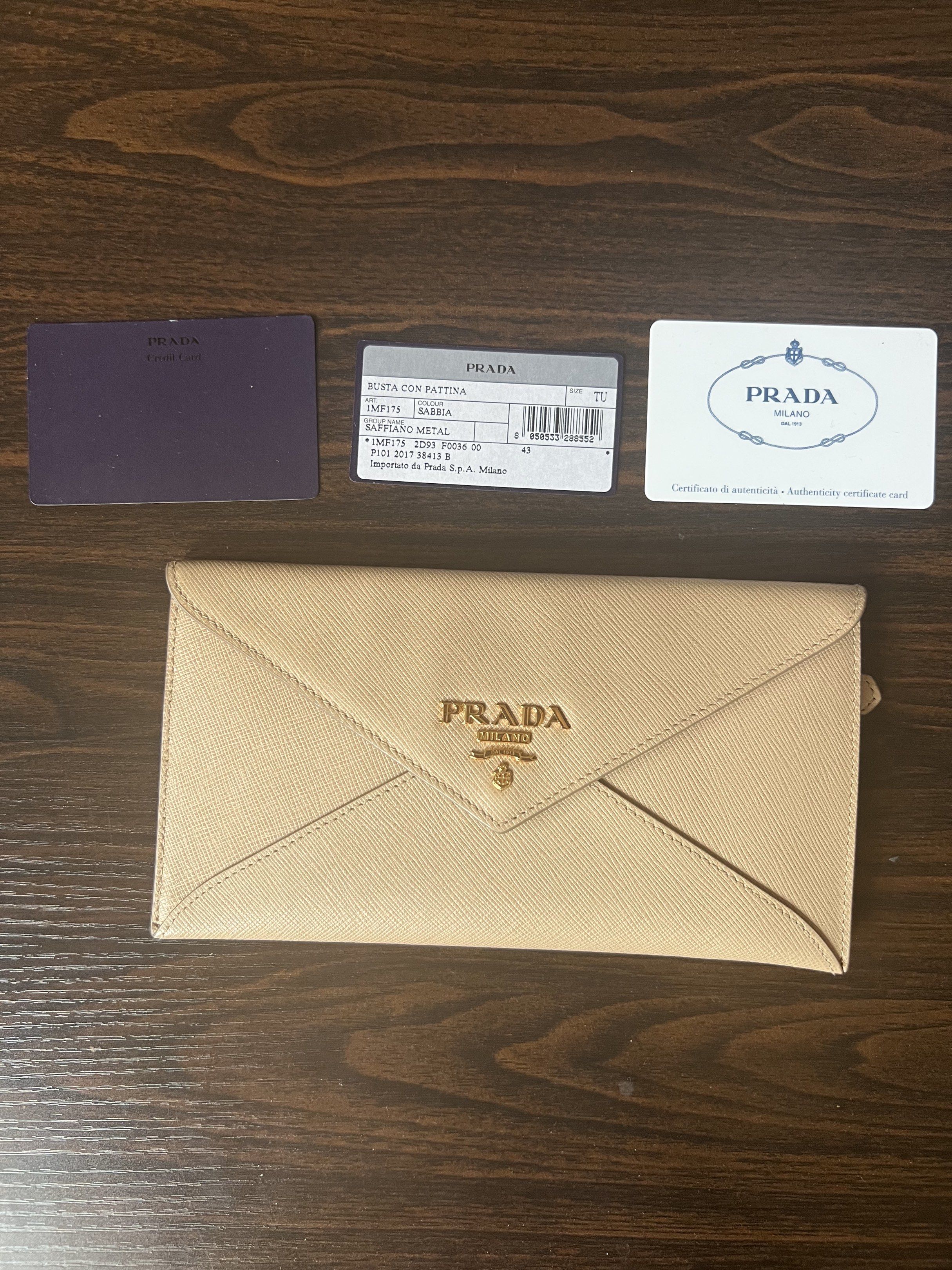 Prada Saffiano Envelope Wallet (Category: Luxury Bags & Wallets) located in Muntinlupa City. Submitted by thecatwalk (Listing ID 1427323924, Image 1). Description: Authentic Prada Saffiano Leather Envelope wallet in Beige With Authenticity cards Pre-loved in great condition No flaws 3 card inner pockets 1 outside zipper pocket Perfect for traveling, can fit passport, cash cards and coins. Super chic, sleek design .
