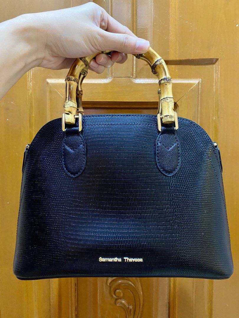 Samantha Thavasa Black Handbag with Bamboo Handle (Category: Luxury Bags & Wallets) located in Bay. Submitted by baggsy416 (Listing ID 1427402813, Image 1). Description: Original Samantha Thavasa handbag Black in color Bamboo handle Gold hardware Bag is good as new Issue: missing sling.