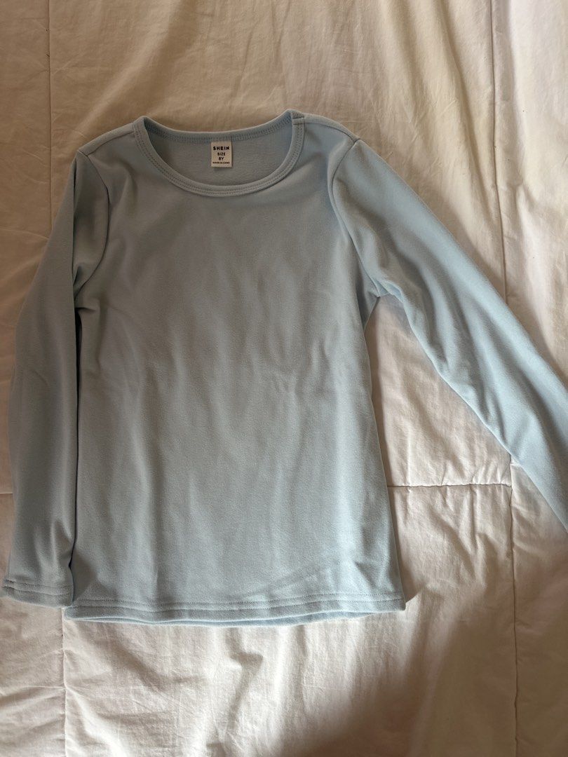 Shein Long Sleeve Warmers - Size 8Y (Category: Babies & Kids Fashion) located in Muntinlupa City. Submitted by shopnb (Listing ID 1427383389, Image 1). Description: Light blue long sleeve shirt from Shein. Features a round neckline. The size is 8Y..