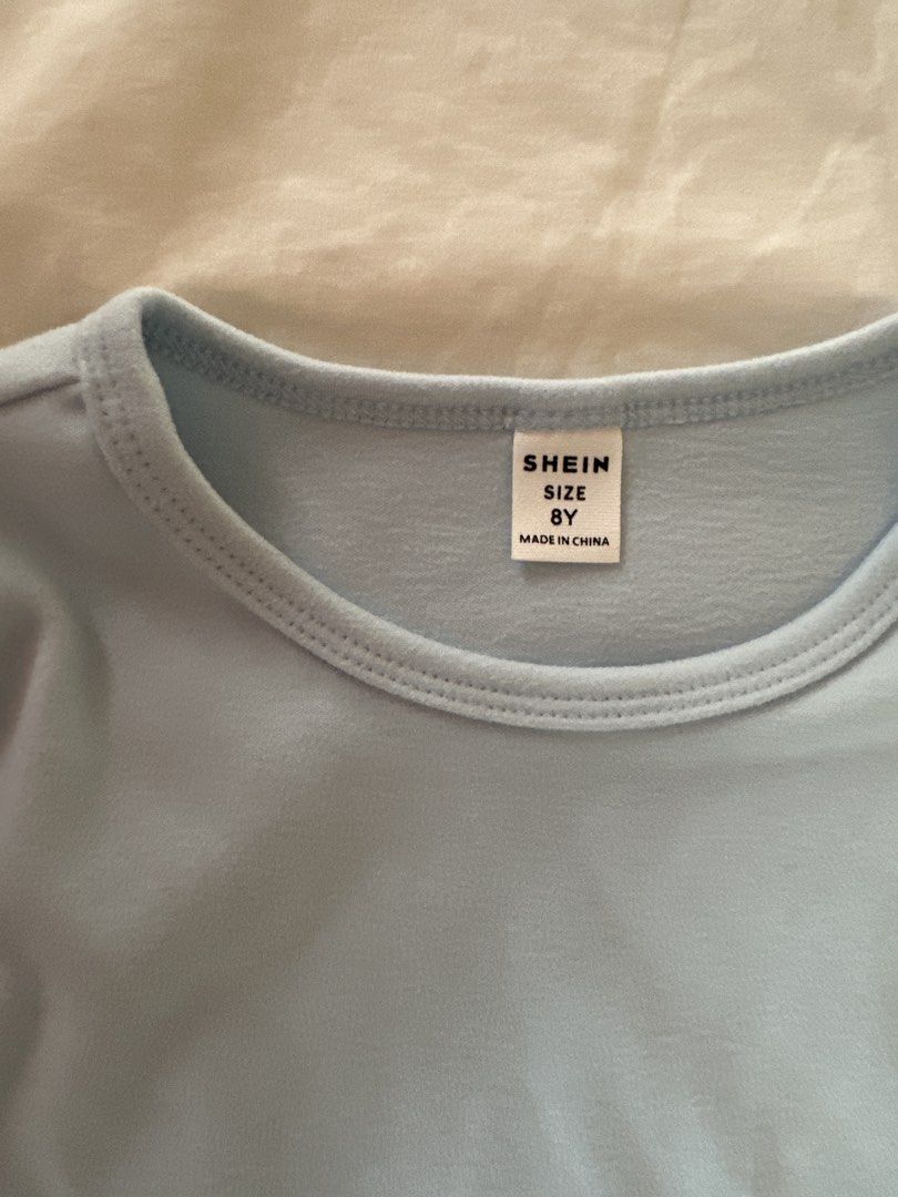 Shein Long Sleeve Warmers - Size 8Y (Category: Babies & Kids Fashion) located in Muntinlupa City. Submitted by shopnb (Listing ID 1427383389, Image 3). Description: Light blue long sleeve shirt from Shein. Features a round neckline. The size is 8Y..