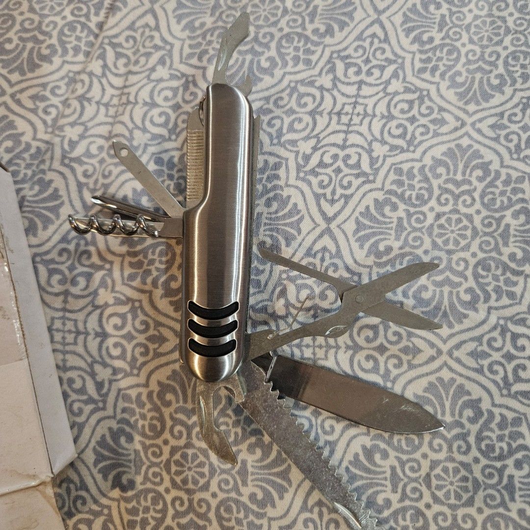 Stainless Steel Multi-tool (Category: Construction Tools & Equipment) located in Manila. Submitted by smartluxeph (Listing ID 1427378871, Image 2). Description: 🔧 Multi-Tool Pocket Knife (Swiss-style) – Stainless Steel 🛠️✨ 💎 All-in-one tool for everyday use 💎 Includes: knife, scissors, saw, bottle opener, corkscrew, nail file + more 💎 Compact & easy to carry (EDC essential 👀) 💎 Durable stainless steel body 🏕️ Perfect for: • Travel / campi