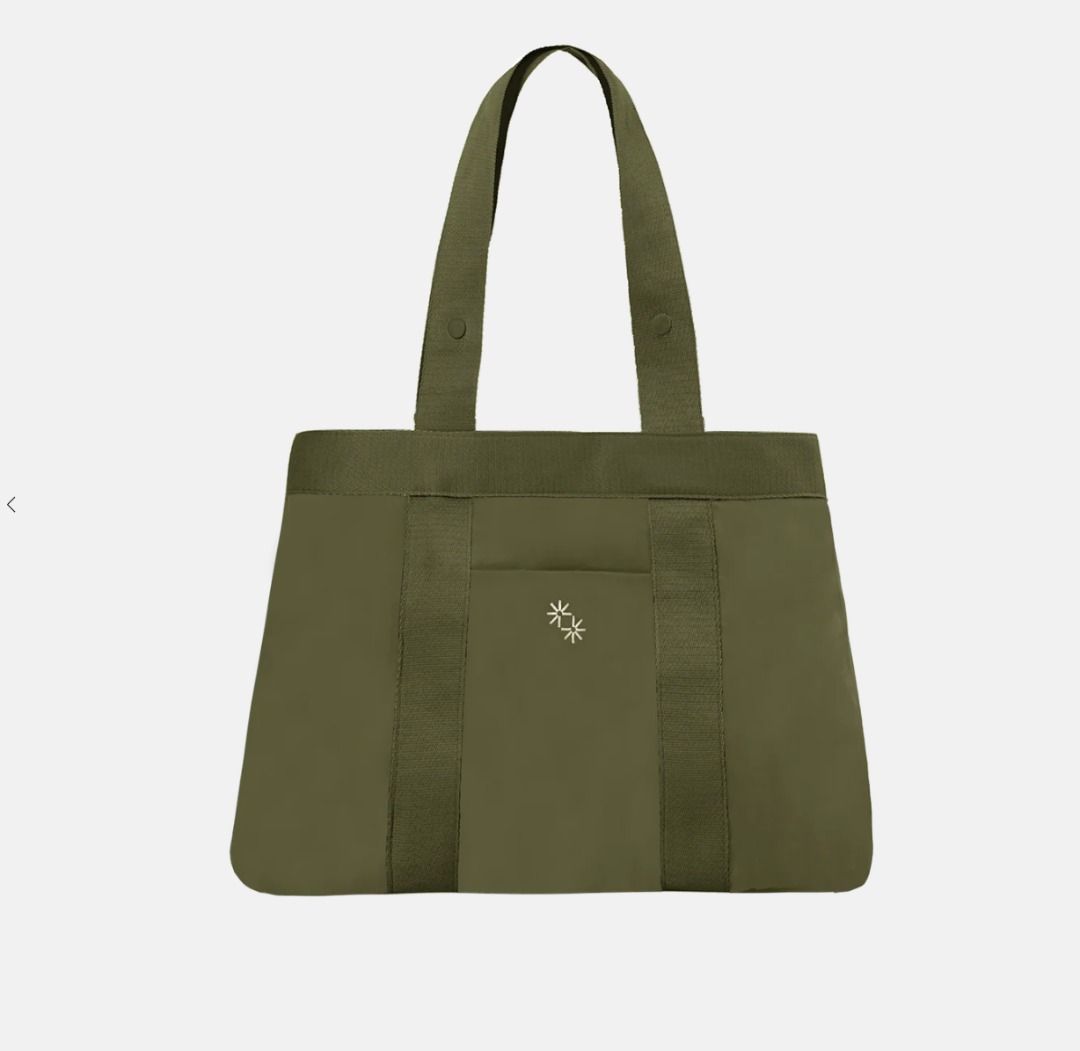 The Paper Bunny Multi-Way Tote (Olive) (Category: Tote Bags) located in Santa Rosa. Submitted by erimv (Listing ID 1427427889, Image 3). Description: The Multi-Way Tote accompanies you from work to play and comes with a luggage slot and zip closure for convenience on-the-go. Transform your Everyday work bag into a Workhorse carry-all, or into a Staple tote. Product Details: Made with water-resistant nylon Converts into 4 sizes: Workhorse, Shopper