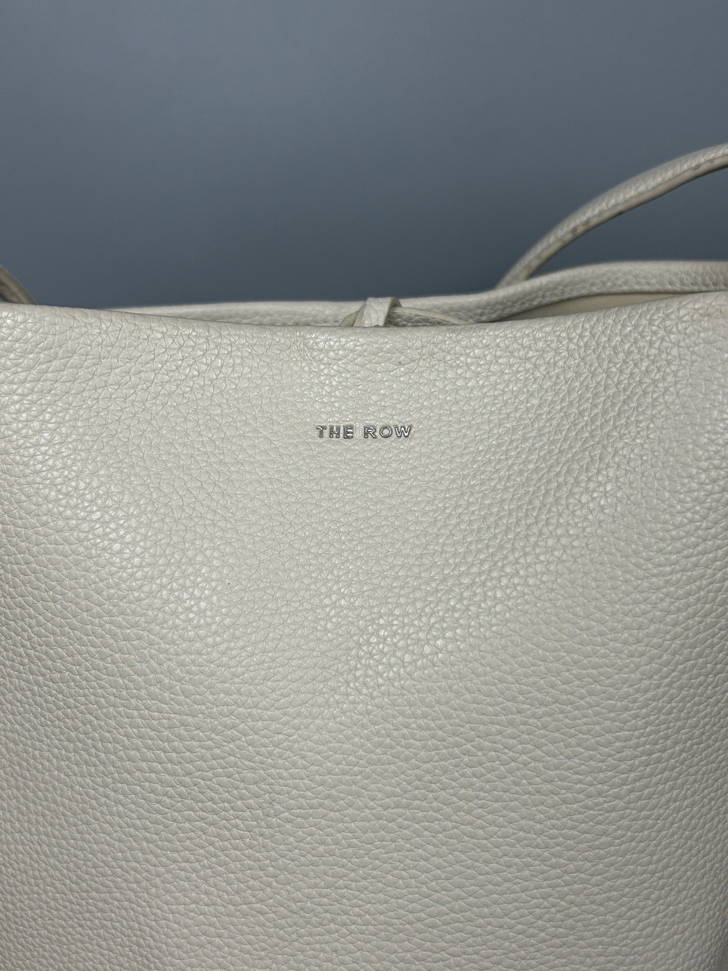 The Row Leather NS Park Bag (Category: Luxury Bags & Wallets) located in Manila. Submitted by 3rdealz (Listing ID 1427321599, Image 2). Description: The row Used condition Courier: J&T or Lalamove Item will be posted by express shipping (J&T) with good tracking record in 1-3 business days after received cleared payment. Expect it to reach you in 3-7 business days only after item been shipped. Please check my other listings and take advantage of c
