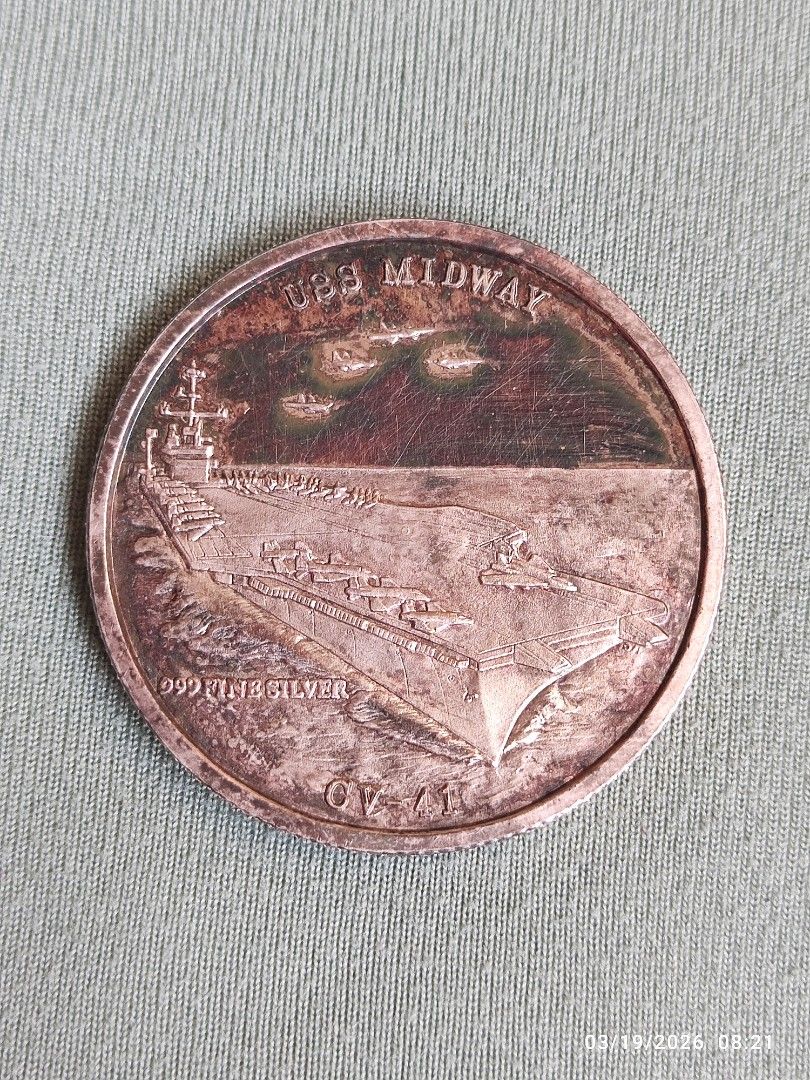 1 oz silver (Category: Currency) located in Tagum. Submitted by cs1907 (Listing ID 1427315098, Image 1). Description: Commemorative coin features the USS Midway on one side and commemorates Operation Desert Storm on the other. The coin is marked with "999 Fine Silver" and "CV-41". The Operation Desert Storm side features an eagle design. A great collectible item for history enthusiasts or coin collectors..