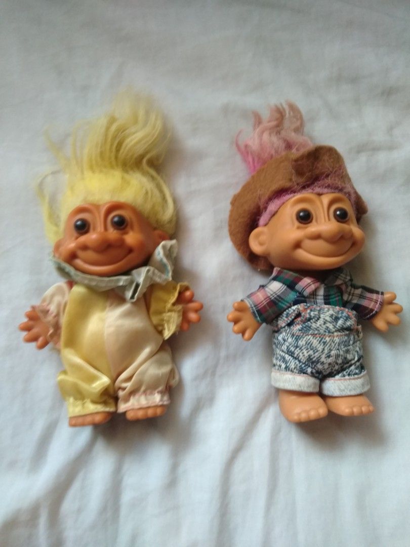 Vintage Russ Troll Dolls (Category: Toys & Games) located in Manila. Submitted by racgeb (Listing ID 1427325279, Image 1). Description: legit 90s Adorable vintage Russ Troll Dolls. One doll has yellow hair and a yellow outfit, while the other has pink hair and a hat with a plaid shirt and denim shorts. The feet of one doll is marked with "China" and "Russ". what u see is what u get selling as both : 1.2k firm / fixed price ship @ buyer expense la