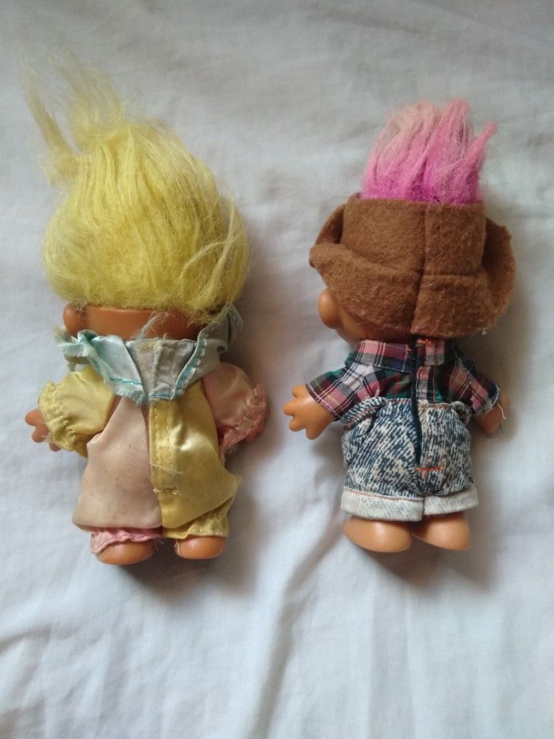 Vintage Russ Troll Dolls (Category: Toys & Games) located in Manila. Submitted by racgeb (Listing ID 1427325279, Image 3). Description: legit 90s Adorable vintage Russ Troll Dolls. One doll has yellow hair and a yellow outfit, while the other has pink hair and a hat with a plaid shirt and denim shorts. The feet of one doll is marked with "China" and "Russ". what u see is what u get selling as both : 1.2k firm / fixed price ship @ buyer expense la