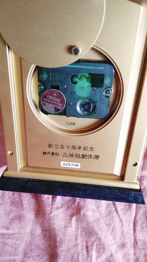 Vintage seiko Decor Quartz Clock (Category: Clocks) located in Caloocan City. Submitted by chrysan_025 (Listing ID 1427359483, Image 3). Description: Mabigat siya. Vintage Decor quartz clock with a gold-colored frame and a white face. The clock features Roman numerals and black hands. The back of the clock has Japanese text and a battery compartment..