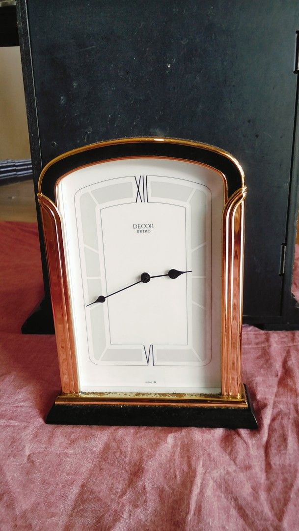 Vintage seiko Decor Quartz Clock (Category: Clocks) located in Caloocan City. Submitted by chrysan_025 (Listing ID 1427359483, Image 1). Description: Mabigat siya. Vintage Decor quartz clock with a gold-colored frame and a white face. The clock features Roman numerals and black hands. The back of the clock has Japanese text and a battery compartment..
