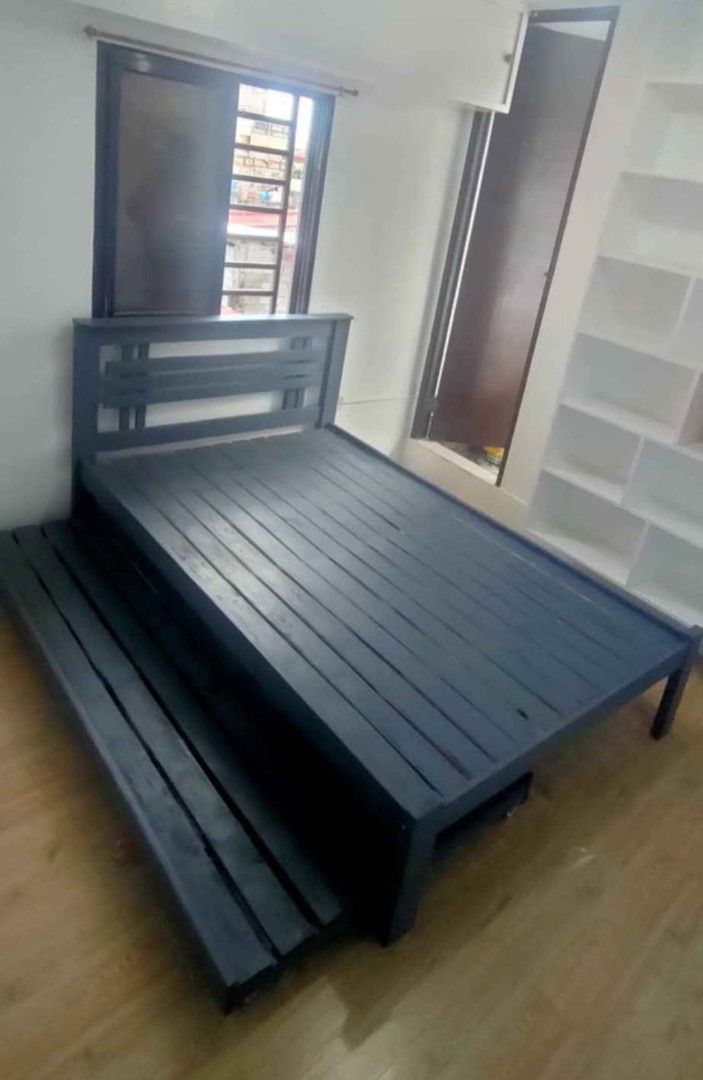 Wooden Bed Frame with Pull-Out Bed (Category: Bed Frames & Mattresses) located in Manila. Submitted by rhoda_81 (Listing ID 1427406758, Image 1). Description: made to order pure palochina wood double size 48inches pull out single 36inches black color we accept cotumized design and size also open request any paint color are available located shop cavite for interest client please call me or mssgs me .