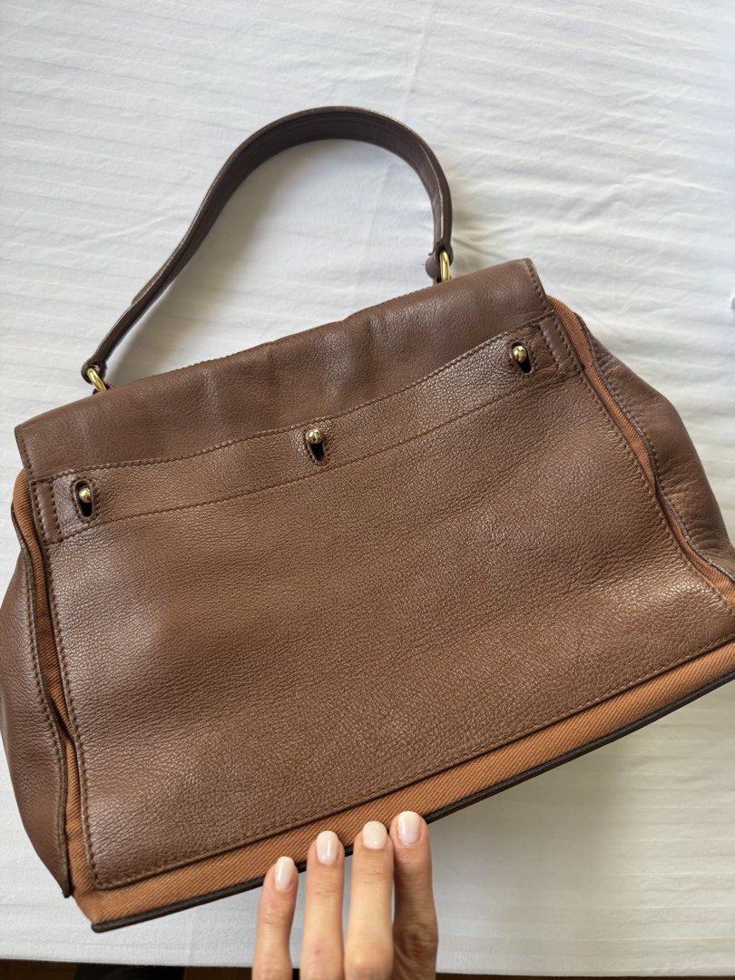Selling low! Classic YSL Muse 2 Satchel (medium) (Category: Luxury Bags & Wallets) located in Makati City. Submitted by curatedandnearlynew (Listing ID 1427350194, Image 3). Description: - Lightly Used - Top Handle, can be held or worn on the shoulder comfortable - small pen ink stain inside - no major flaws - can fit a lot and perfect for the work to weekend use :) - Bought in Paris and RFS = decluttering - Comes with cloth bag Negotiable! Just 