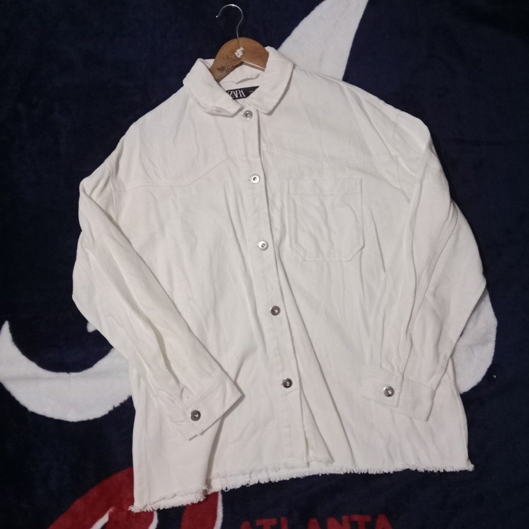 Zara Cream White Denim Jacket XS (Category: Coats, Jackets and Outerwear) located in Silang. Submitted by densrodrig08604 (Listing ID 1427375123, Image 1). Description: Cream white denim jacket from Zara. Features a button-down front, a single chest pocket, and a raw hem. The jacket is made in Cambodia. Size XS. Measurements are approximately 20-21 inches across the chest and 27-28 inches in length. excellent condition no issue,needwash only paym