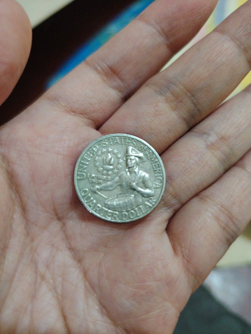 1976 US Quarter Dollar Coin (Category: Currency) located in Iligan City. Submitted by shehabdor98515 (Listing ID 1424338372, Image 2). Description: - 1976 US Quarter Dollar coin. - Obverse: George Washington, inscriptions: "Liberty" and "1776-1976". - Reverse: Colonial drummer. - Collectible item..