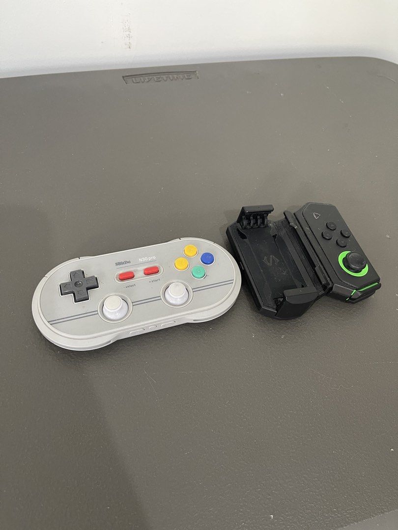 8BitDo N30 Pro 2 & Black Shark Controller (Category: Controllers) located in Muntinlupa City. Submitted by snapbackandmore (Listing ID 1424198046, Image 1). Description: - Includes 8BitDo N30 Pro 2 controller (retro SNES design) Plus Black Shark controller (black with green accents) - Black Shark controller features a phone clip .
