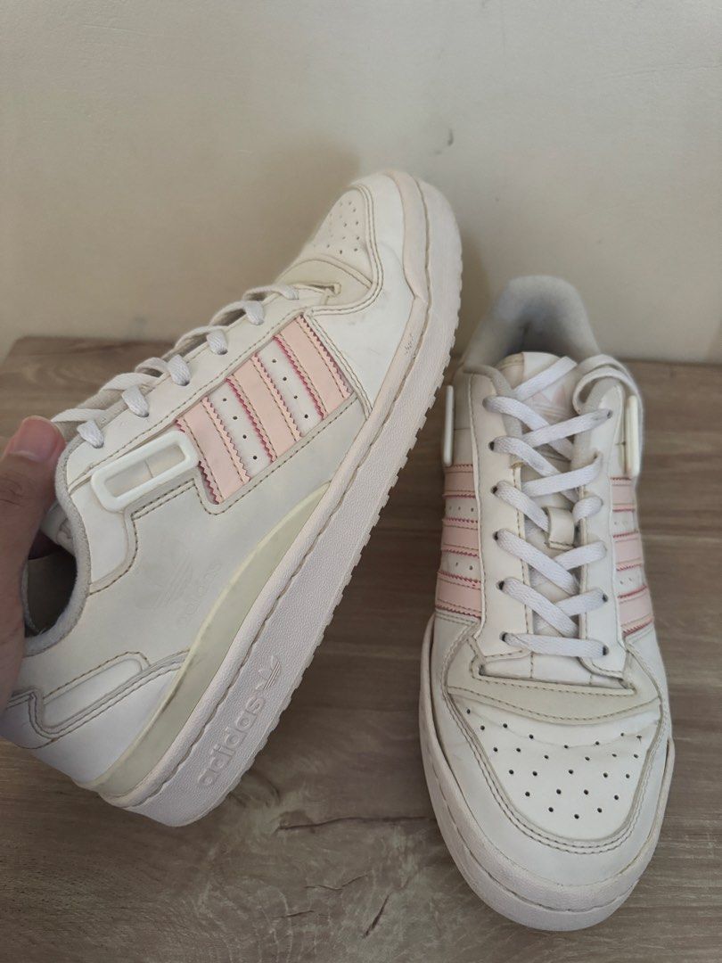 Adidas Forum Low White Pink Sneakers (Category: Sneakers) located in Taytay. Submitted by darkswan016 (Listing ID 1424240868, Image 3). Description: Adidas Forum Low sneakers in white with pink stripes. Features a lace-up closure and a strap. The size is US 8.5. Made in Indonesia. The shoes have some signs of wear on the soles and uppers..