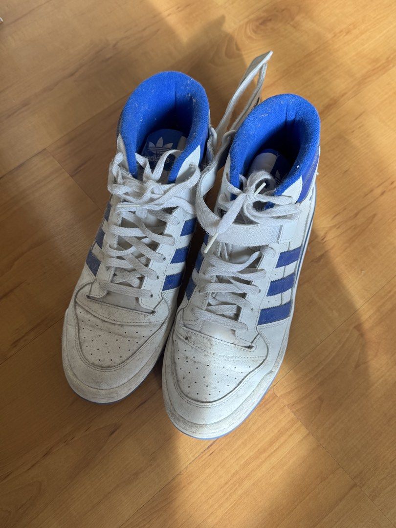 Adidas Forum Mid White Blue Sneakers (Category: Sneakers) located in Cavite. Submitted by devareaux (Listing ID 1424164668, Image 3). Description: - Adidas Forum Mid sneakers - White and blue colorway - Adidas logo on tongue and side - Strap closure - Blue accents on collar and stripes - Blue soles - Visible size tag - i rarely use it .