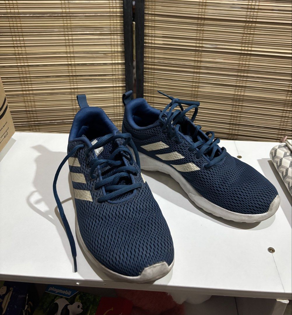 (Original) Adidas Running Shoes Blue (Category: Sneakers) located in Dasmarinas. Submitted by ftcbaldovino (Listing ID 1424236235, Image 2). Description: - Adidas running shoes - Size: Women’s US 8.5 - Blue with white stripes - Breathable mesh upper - White soles - Lace-up closure - Heel pull tab - Minor sole wear - Suitable for daily wear and light activity.