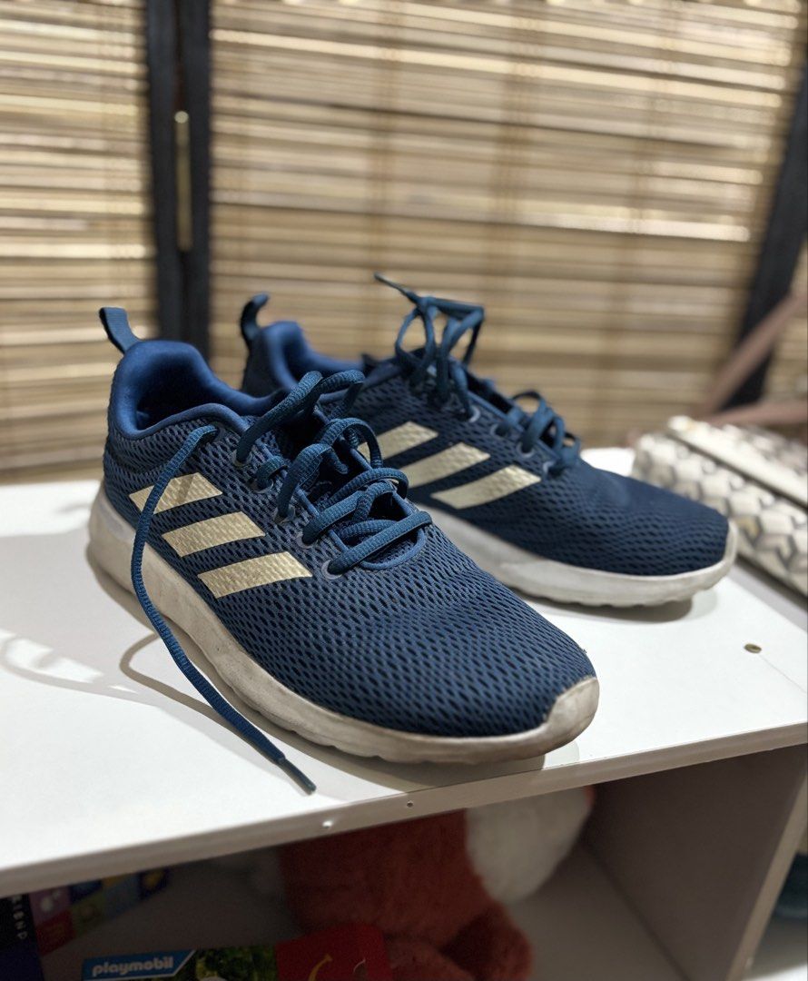 (Original) Adidas Running Shoes Blue (Category: Sneakers) located in Dasmarinas. Submitted by ftcbaldovino (Listing ID 1424236235, Image 1). Description: - Adidas running shoes - Size: Women’s US 8.5 - Blue with white stripes - Breathable mesh upper - White soles - Lace-up closure - Heel pull tab - Minor sole wear - Suitable for daily wear and light activity.