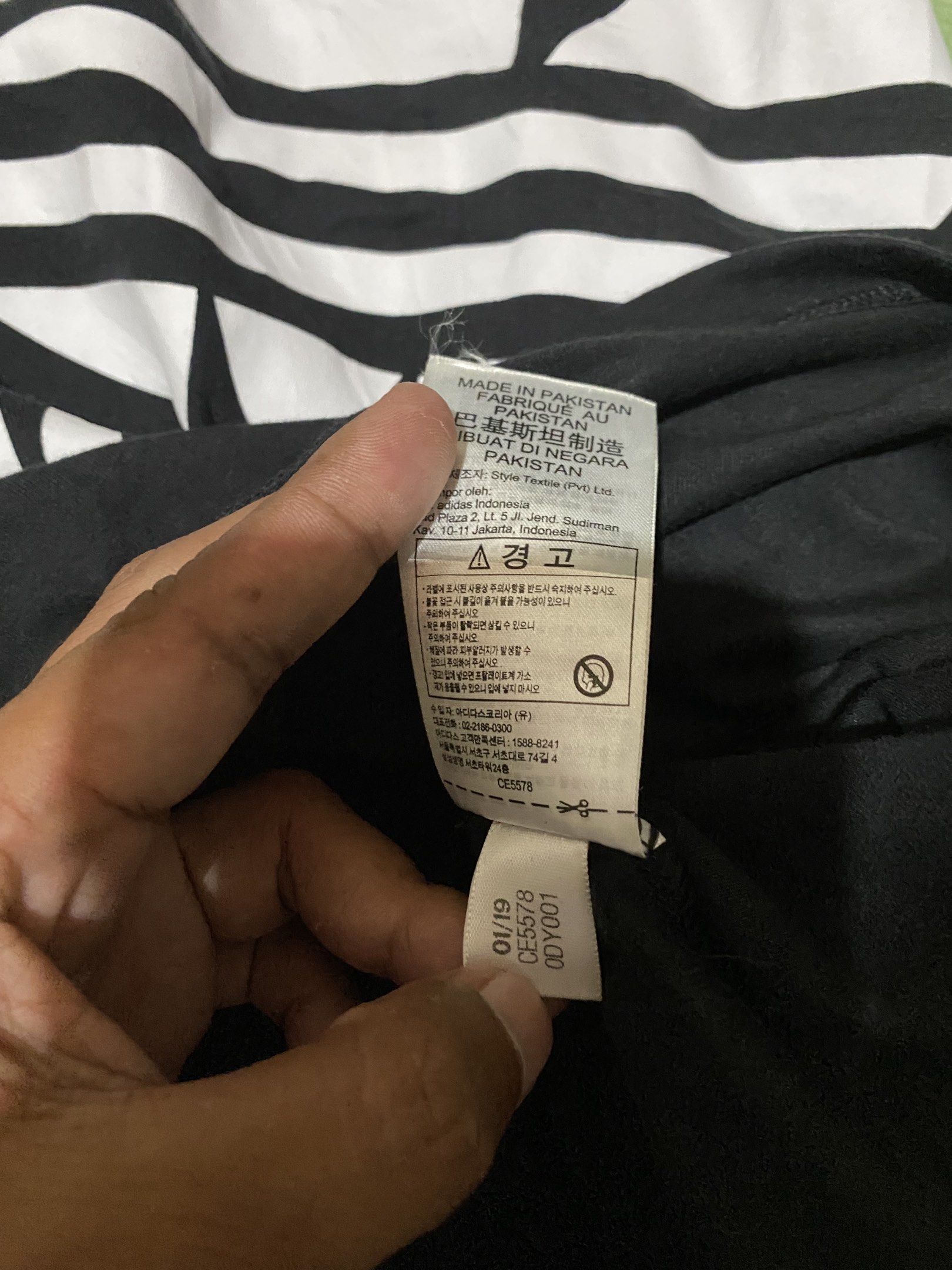 Adidas Trefoil Tank Top - Black (Category: Sleeveless) located in Tagum. Submitted by thriftedjon (Listing ID 1424297645, Image 3). Description: - Authentic Adidas tank top - Color: Black - Features a large white Trefoil logo and Adidas text on the front - Sleeveless design - Size: S/P - Made in Pakistan - Small Adidas logo on the back of the neck.
