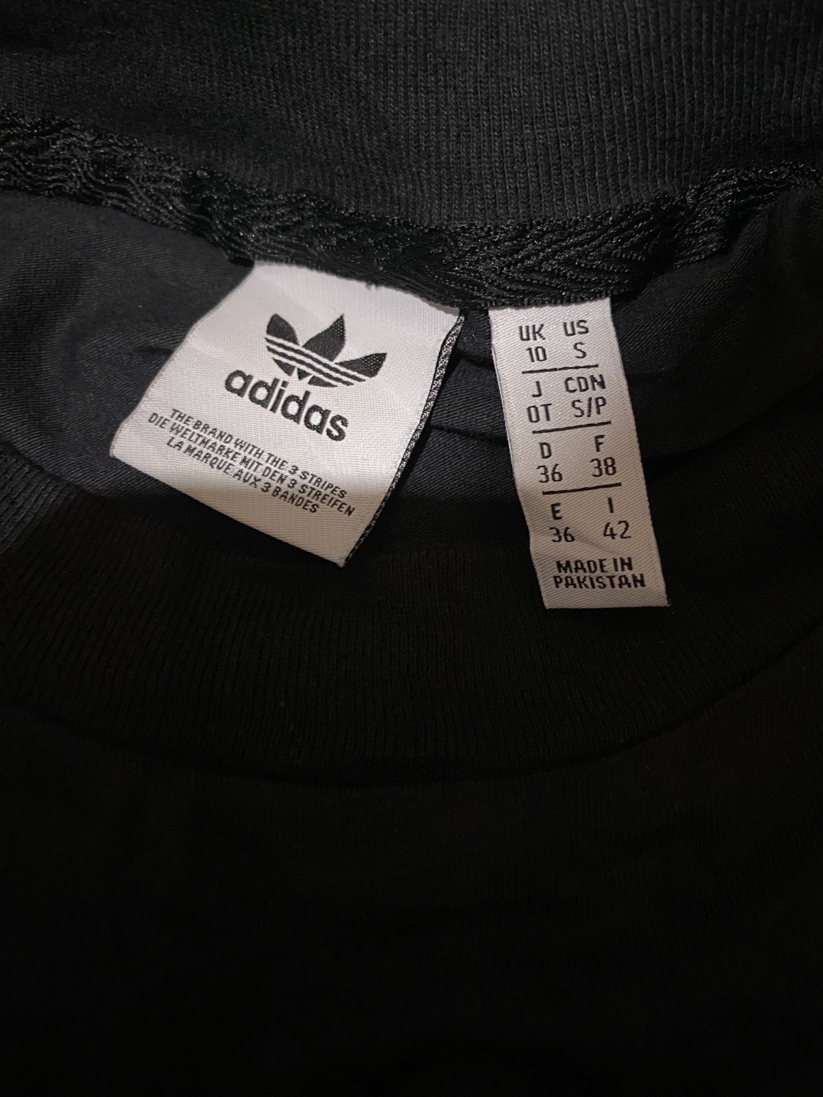 Adidas Trefoil Tank Top - Black (Category: Sleeveless) located in Tagum. Submitted by thriftedjon (Listing ID 1424297645, Image 2). Description: - Authentic Adidas tank top - Color: Black - Features a large white Trefoil logo and Adidas text on the front - Sleeveless design - Size: S/P - Made in Pakistan - Small Adidas logo on the back of the neck.
