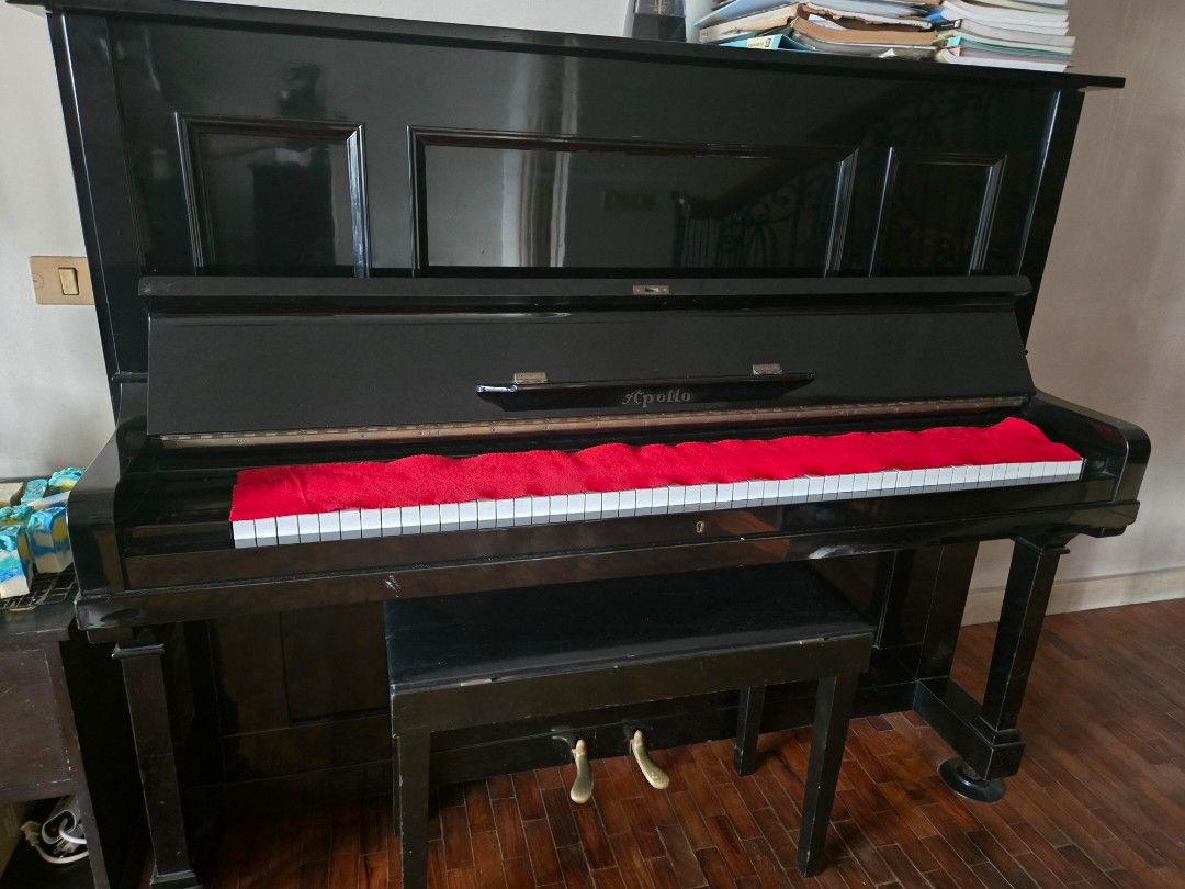 Apollo Piano with Bench (Category: Musical Instruments) located in Pasig City. Submitted by joyrj1 (Listing ID 1424239813, Image 2). Description: - Apollo piano with matching bench - Full keyboard with white and black keys - Black finish - Includes a red cover - Comfortable bench included - Ideal for music enthusiasts and learners - japan made - regularly tuned - ALL NEW HAMMERS negotiable, located in Meralco Avenue, Pasig pm for more details.