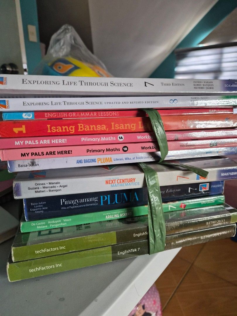 Assorted School Books (Category: Textbooks) located in Rizal. Submitted by sha_ag (Listing ID 1424220047, Image 1). Description: - Assorted school book bundle for students. - Titles include: "Exploring Life Through Science", "English Grammar Lesson", "Isang Bansa, Isang L", "My Pals Are Here!", "Primary Maths", "Next Century", "Pluma", and "English 7". - Exact editions and years not specified. - Sold as a bundle. .