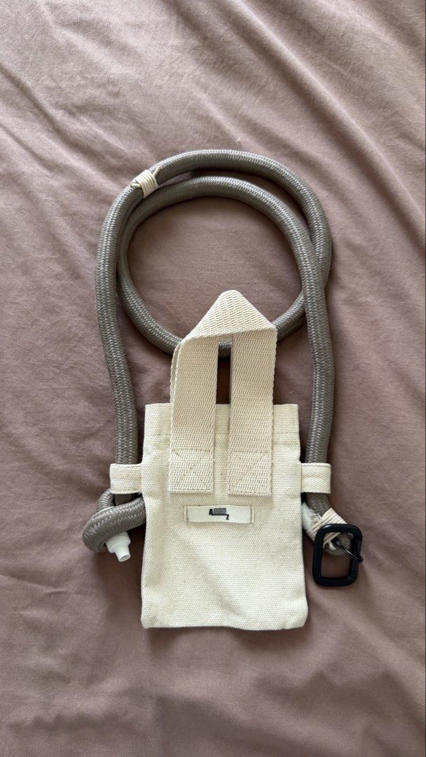 ATOZ Mini Chunky Bag (Off white) (Category: Luxury Bags & Wallets) located in Manila. Submitted by pnrzamora (Listing ID 1424211072, Image 1). Description: Minimalist canvas bag with rope strap. Features a flap and buckle closure. Adjustable strap. Neutral color. Bought in ATOZ for 1.2K Selling for PHP 500.