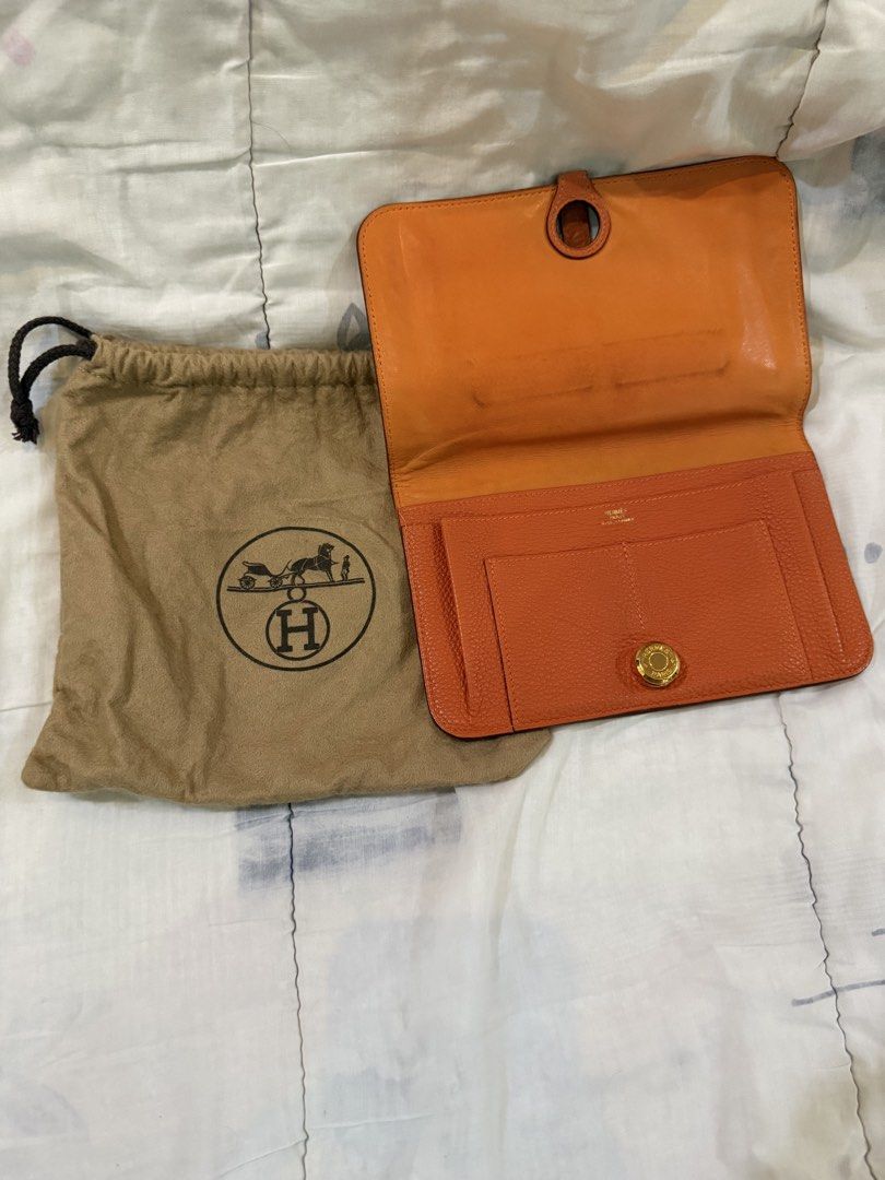 Authentic Hermes Orange Leather Wallet (Category: Luxury Bags & Wallets) located in Paranaque City. Submitted by lovebrand (Listing ID 1424238795, Image 2). Description: Lightly used. Supple to the touch. Iconic orange Hermes color With dustbag For a fraction of the cost, you will own a Hermes branded item already! .