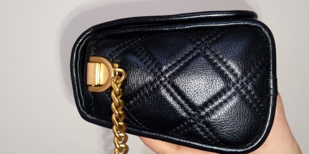Black Quilted Chain Bag (Category: Luxury Bags & Wallets) located in Bacolor. Submitted by pinktintmine (Listing ID 1424235067, Image 2). Description: - Black quilted handbag - Gold chain strap - Gold-colored clasp closure - Interior pocket - Leather or leather-like material - no flaws like new.