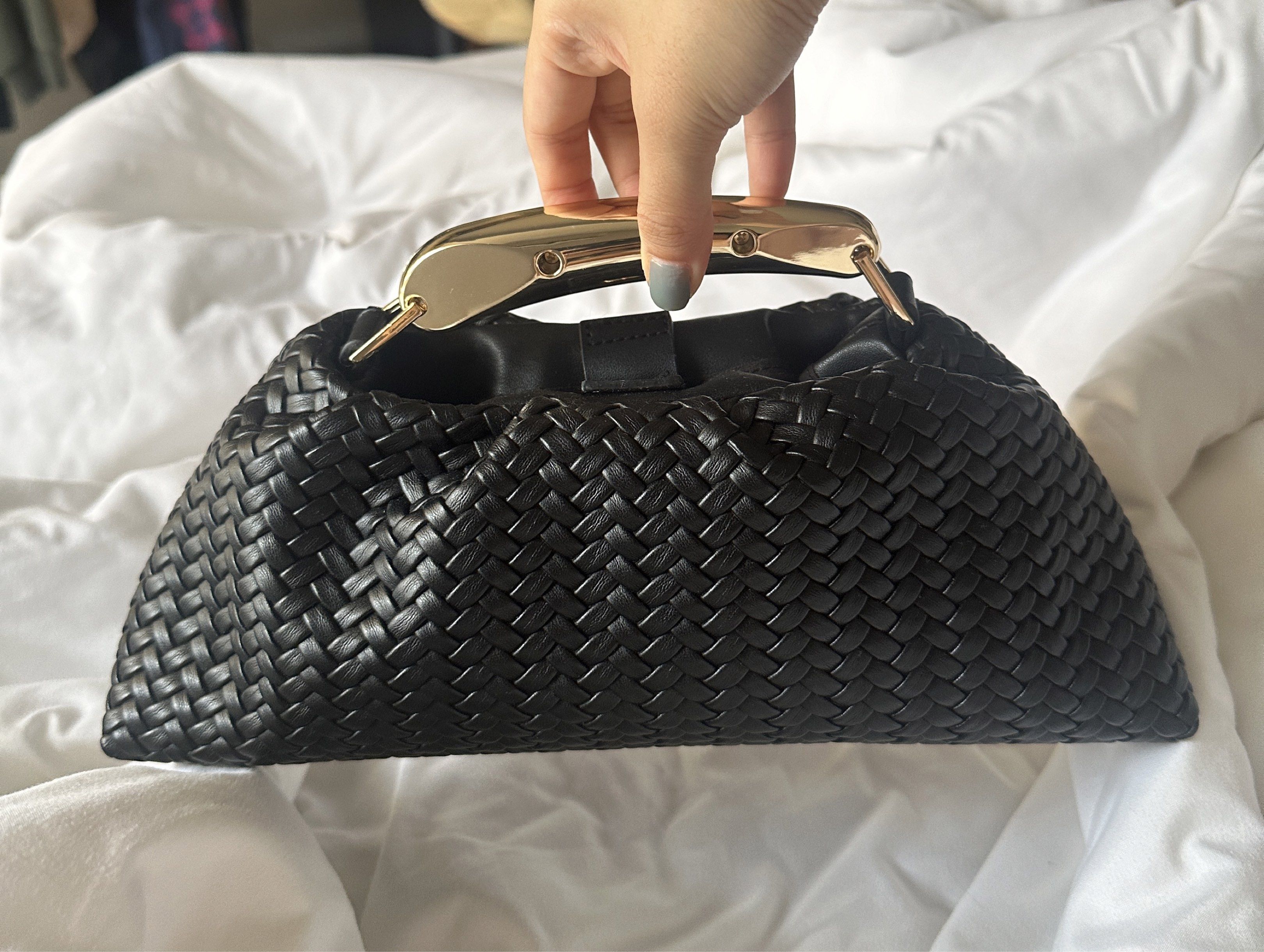 Black Woven Handbag with Gold Handle (Category: Shoulder Bags) located in Manila. Submitted by pck_____ (Listing ID 1424209211, Image 2). Description: - Black woven handbag - Stylish gold handle - Unique woven texture - Secure clasp closure - Clutch-style design - Perfect for essentials - Sleek and modern.