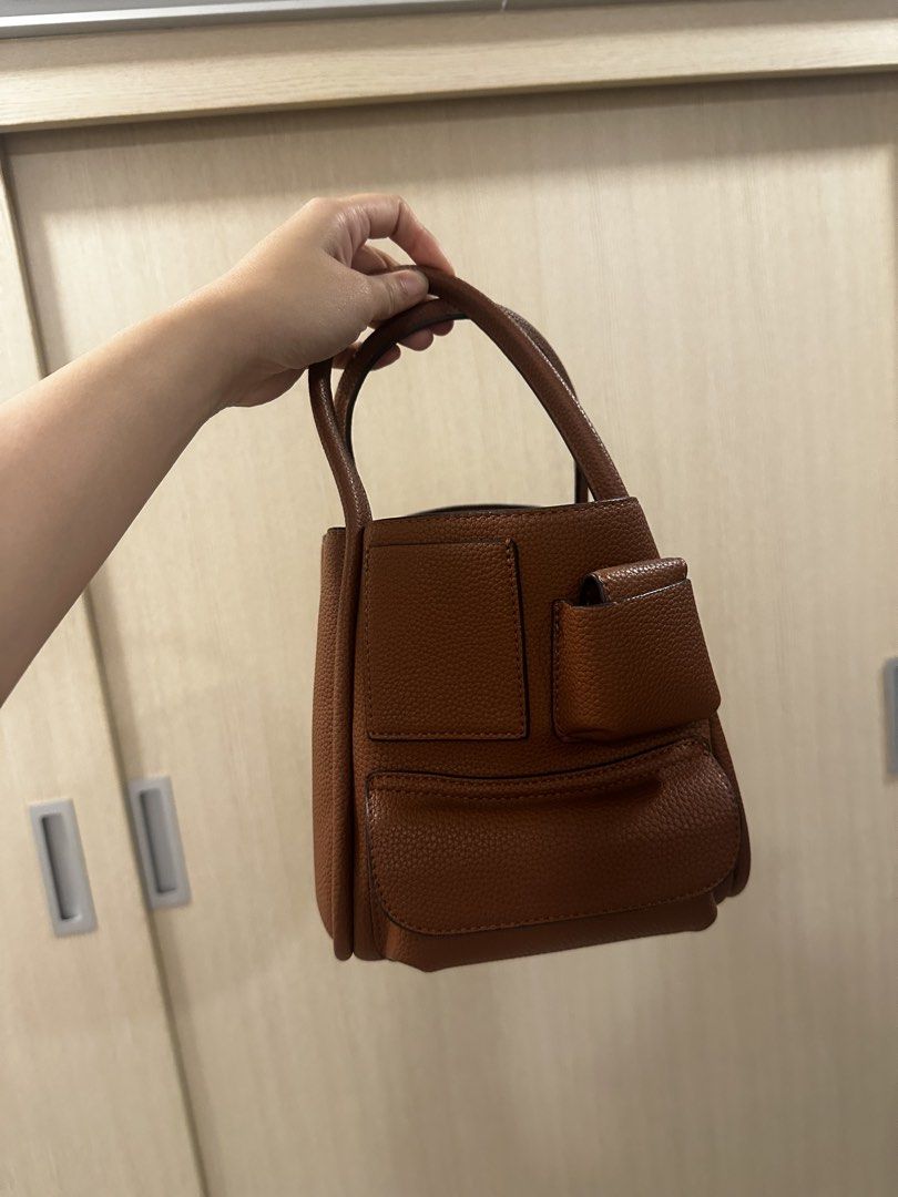 Brown Handbag with Exterior Pockets (Category: Luxury Bags & Wallets) located in Quezon City. Submitted by classythreads (Listing ID 1424283437, Image 1). Description: Bunny brand .