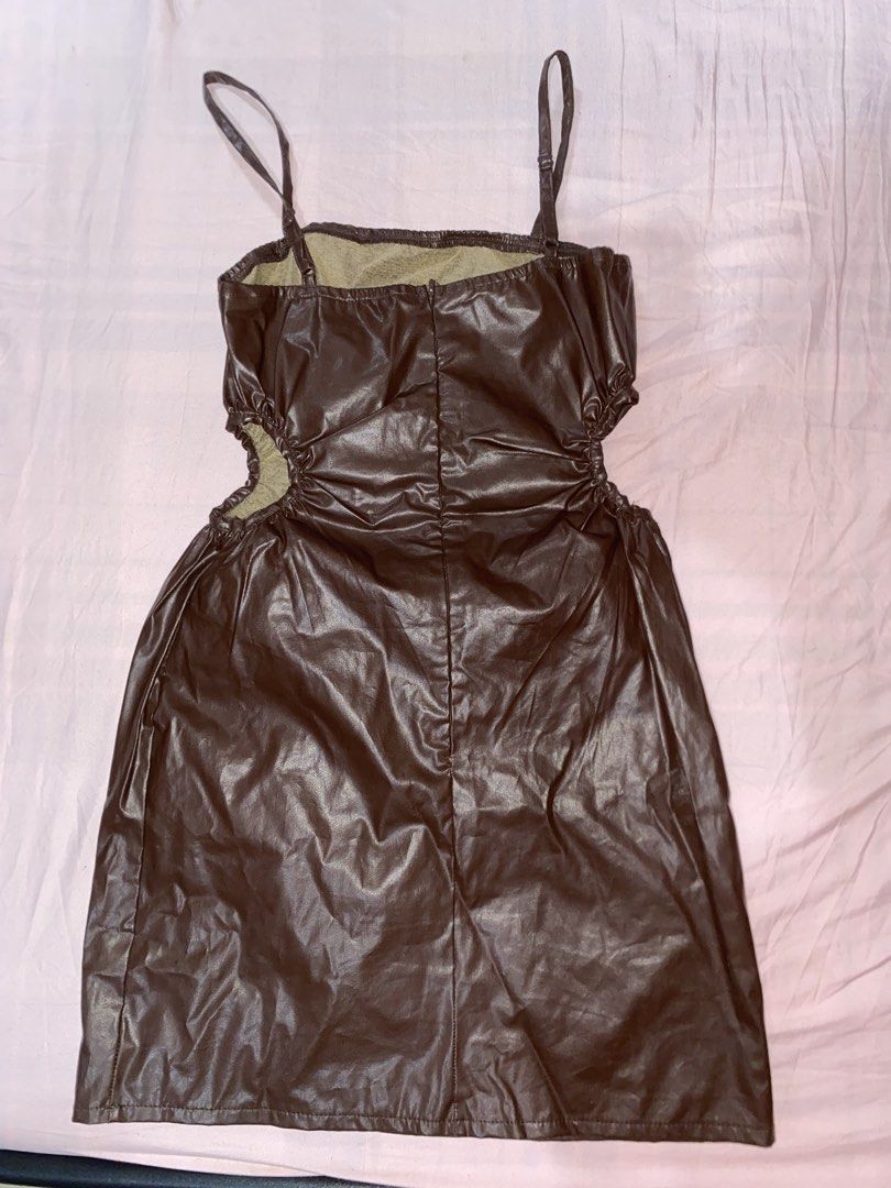 Cute Brown Leather Dress with Straps (Category: Dresses) located in Mariveles. Submitted by preluvbaddie (Listing ID 1424210397, Image 2). Description: - Brown faux leather dress - Features side openings - Fitted silhouette - Adjustable thin straps - Shiny material - Perfect for special occasions or a night out.
