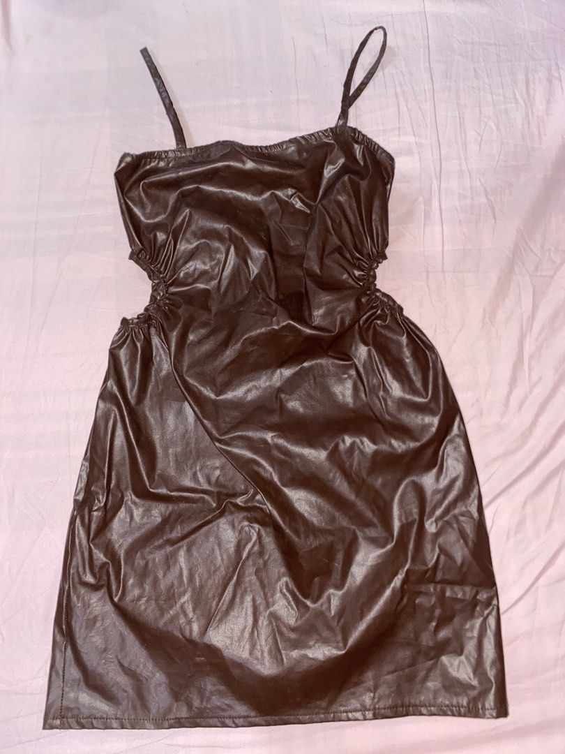 Cute Brown Leather Dress with Straps (Category: Dresses) located in Mariveles. Submitted by preluvbaddie (Listing ID 1424210397, Image 1). Description: - Brown faux leather dress - Features side openings - Fitted silhouette - Adjustable thin straps - Shiny material - Perfect for special occasions or a night out.